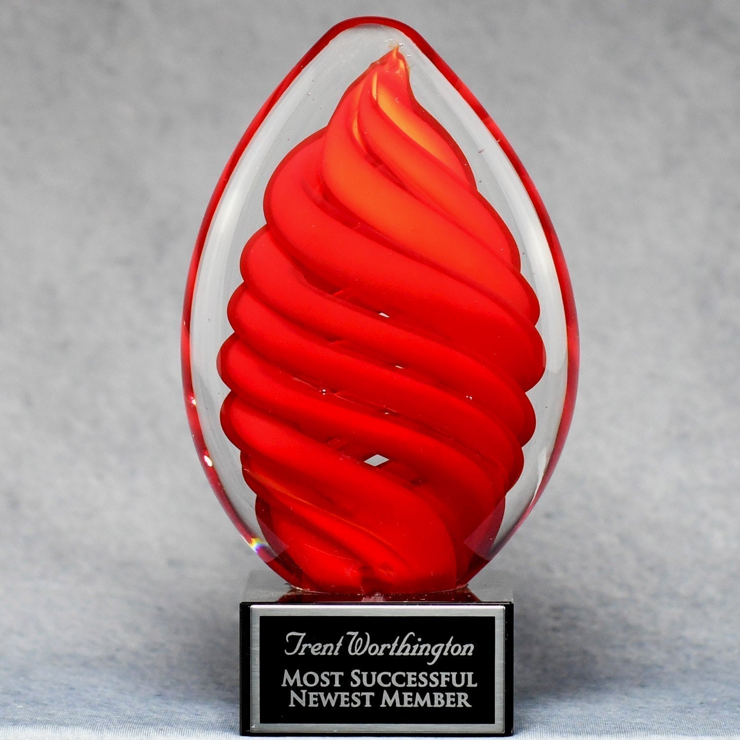 Red Swirl Egg on Black Glass Base